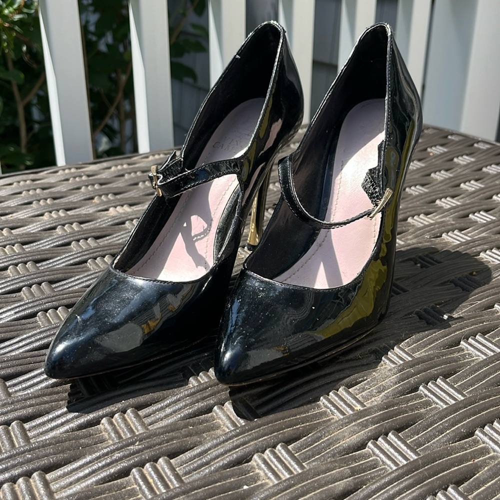 Black patent leather heels.